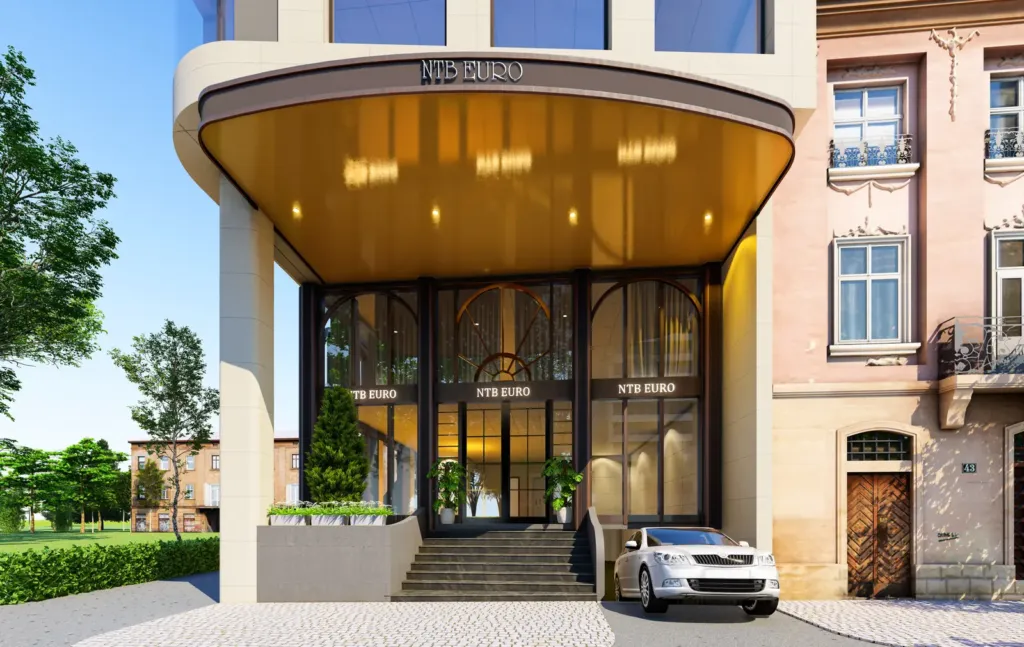 Sảnh chính mái cong ốp trần vàng đồng, cửa kính khung đen, NTB Euro Building Mỗ Lao, Archiindex